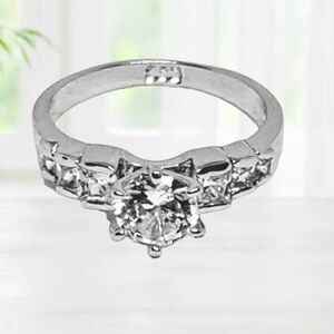 Silver Engagement Ring with Multifaceted Cut CZ Stone